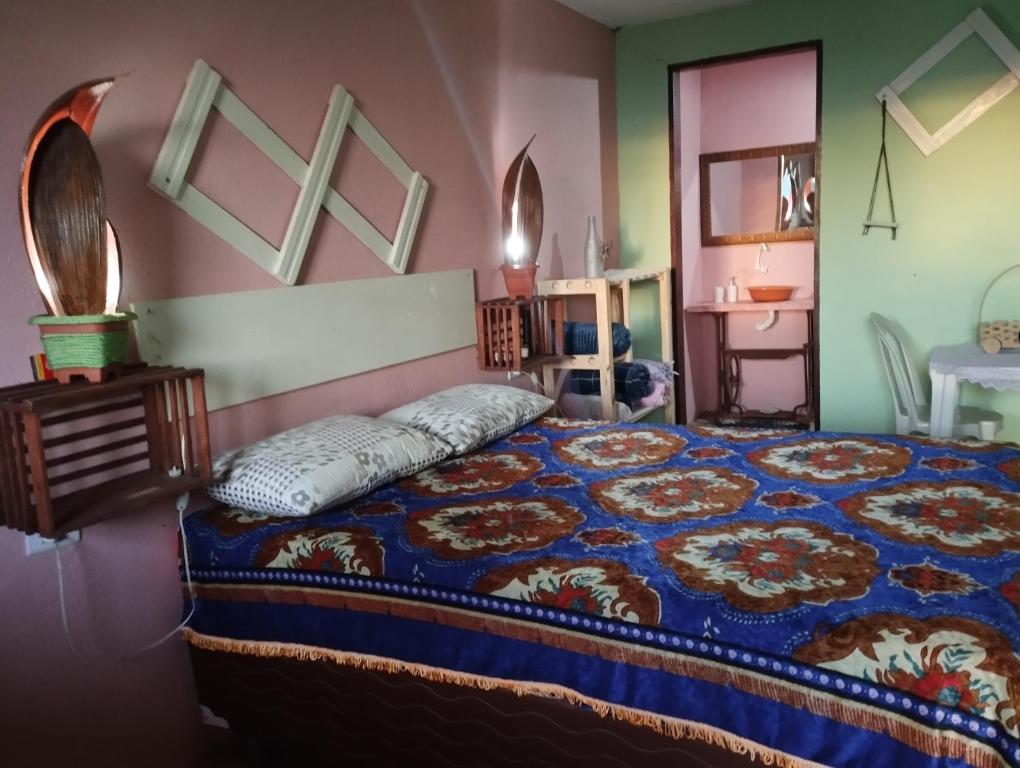 A bed or beds in a room at Colina dos Ventos