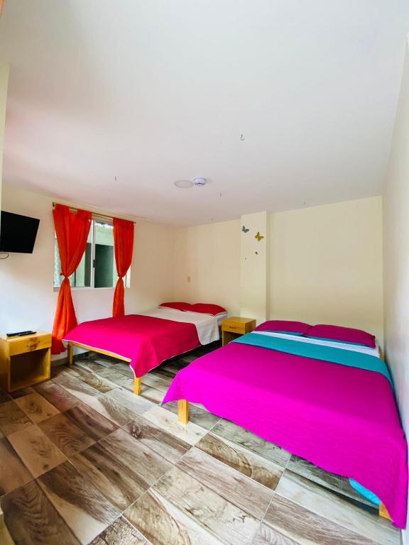 Postel nebo postele na pokoji v ubytování Hostal Don Jose