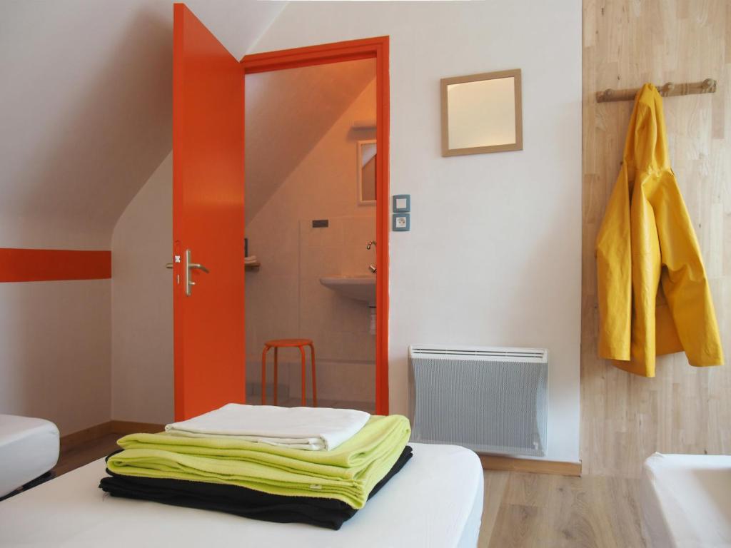 Postel nebo postele na pokoji v ubytování Gîte Les Pingouins de l'Aber