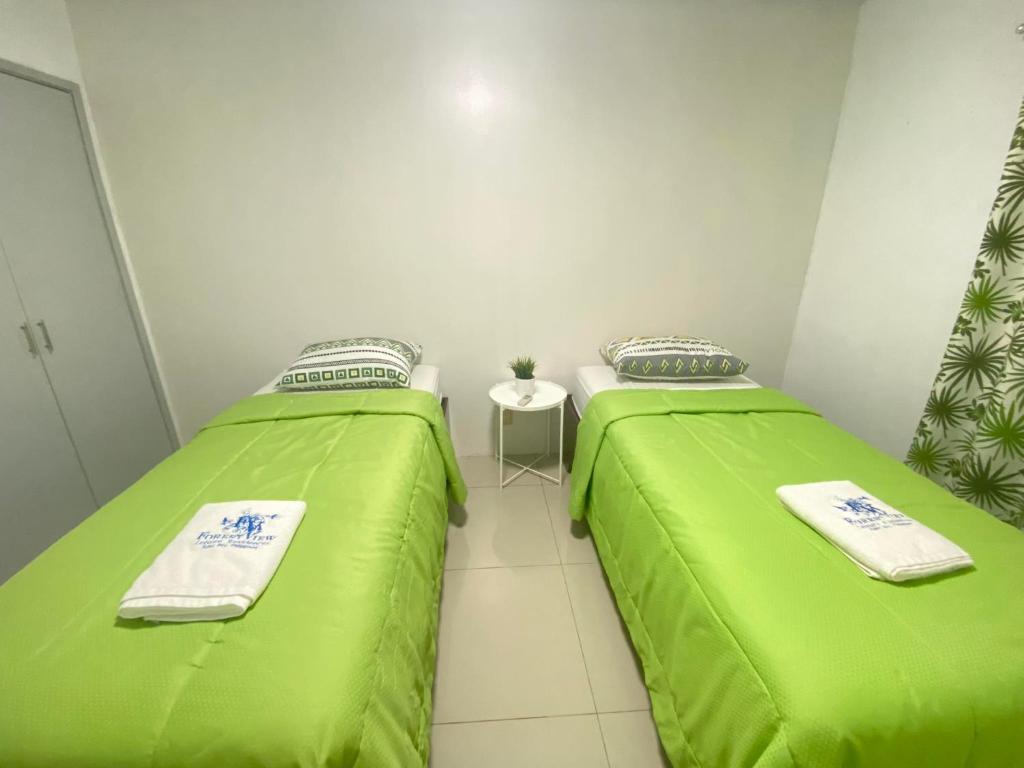 Postel nebo postele na pokoji v ubytování Forest View Leisure Residences