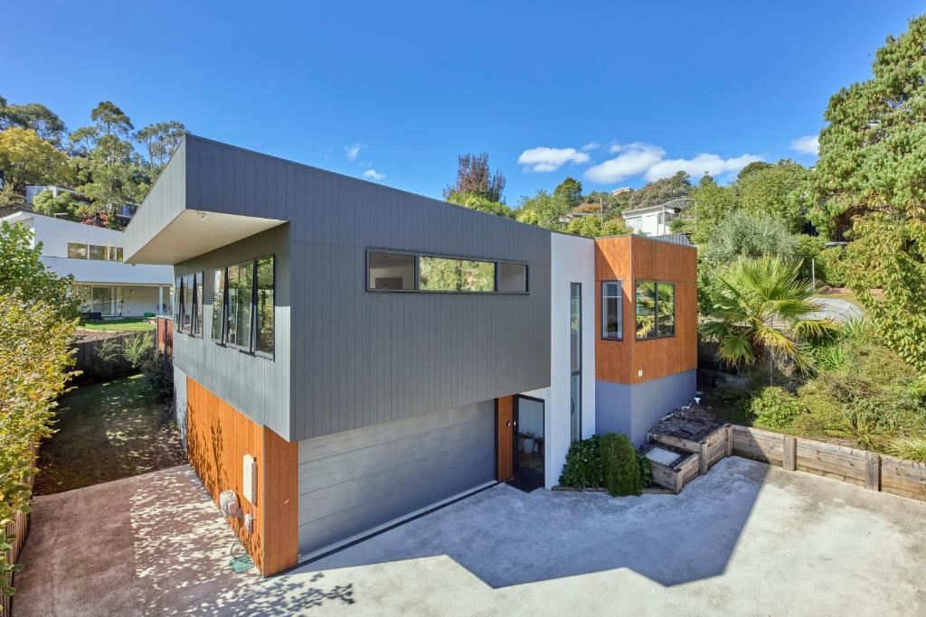a house on a hill with trees at The Gorge Townhouse, stunning home & location! in Royal Park