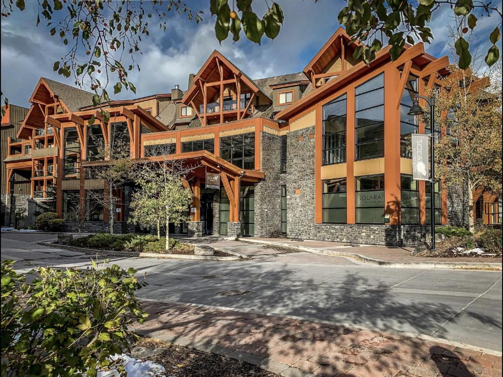 a large wooden building with a lot of windows at Luxury Resort 2BR/2Bath Sleeps 6 in Canmore