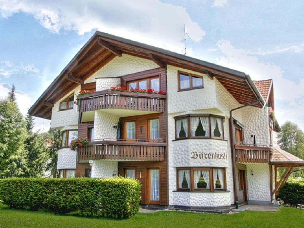 a large house with balconies on the side of it at Bärenhüsli No 7 in Titisee