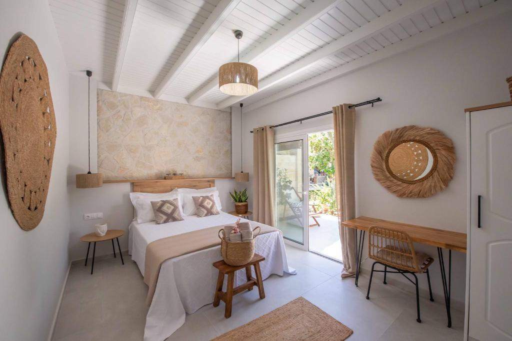Un pat sau paturi într-o cameră la Alex Studios & Apartments