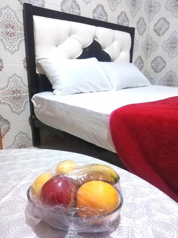 Una cama o camas en una habitación de Aziz House 2
