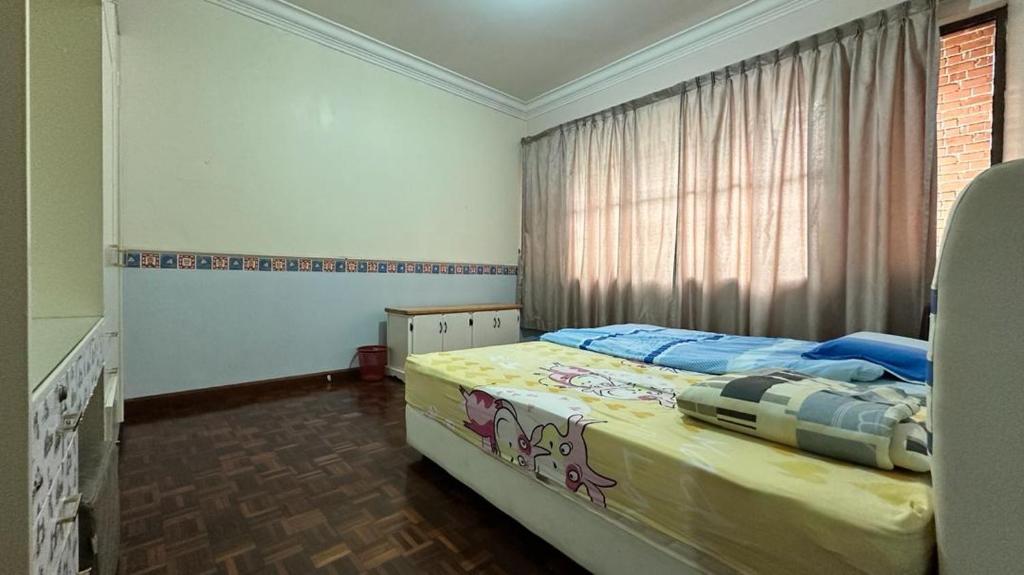 Postel nebo postele na pokoji v ubytování Singa angsa house 狮鵝坊 半独立式别墅