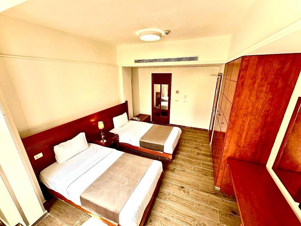 Postel nebo postele na pokoji v ubytování Caesar's Park Hotel