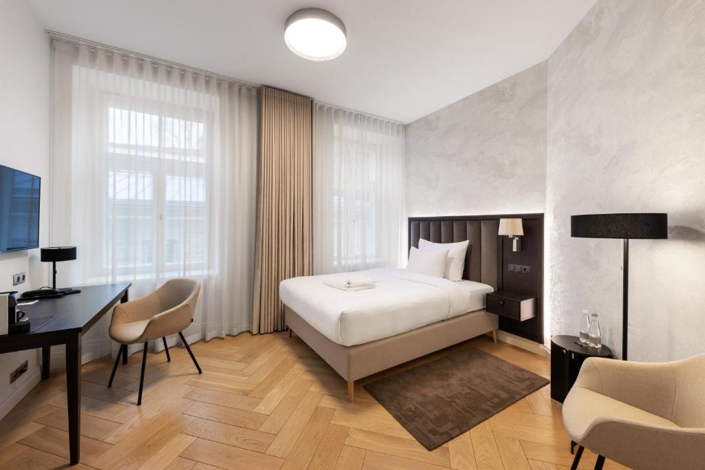 Postel nebo postele na pokoji v ubytování Nunne Boutique Hotel
