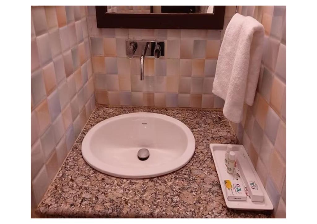 Koupelna v ubytování Hotel Ganga Aatitheyam