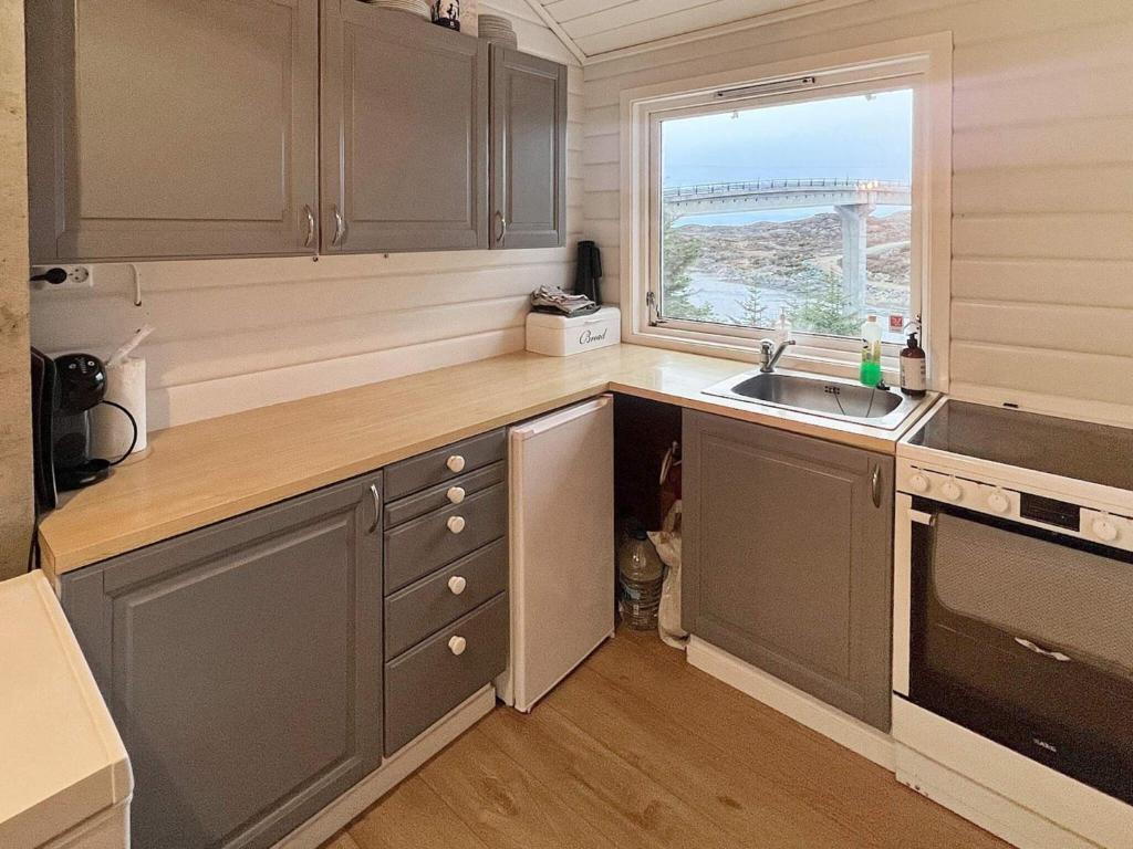 Kuchyň nebo kuchyňský kout v ubytování Holiday home bremnes V