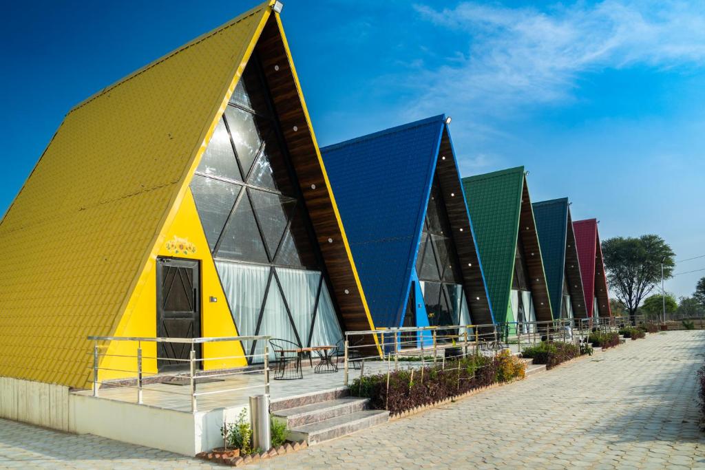 a building with a yellow and blue roof at Sunflower Saga in Jaipur