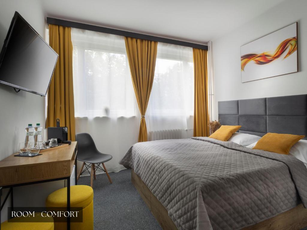Postel nebo postele na pokoji v ubytování Hotel AMITY
