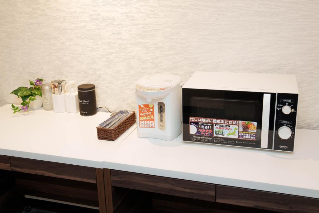 Kuchyň nebo kuchyňský kout v ubytování Osaka City Hotel Kyobashi