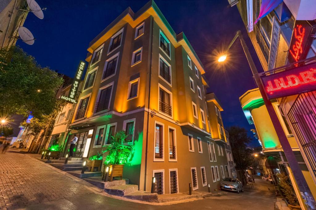 a building on the side of a street at night at Endless Suites Taksim in Istanbul