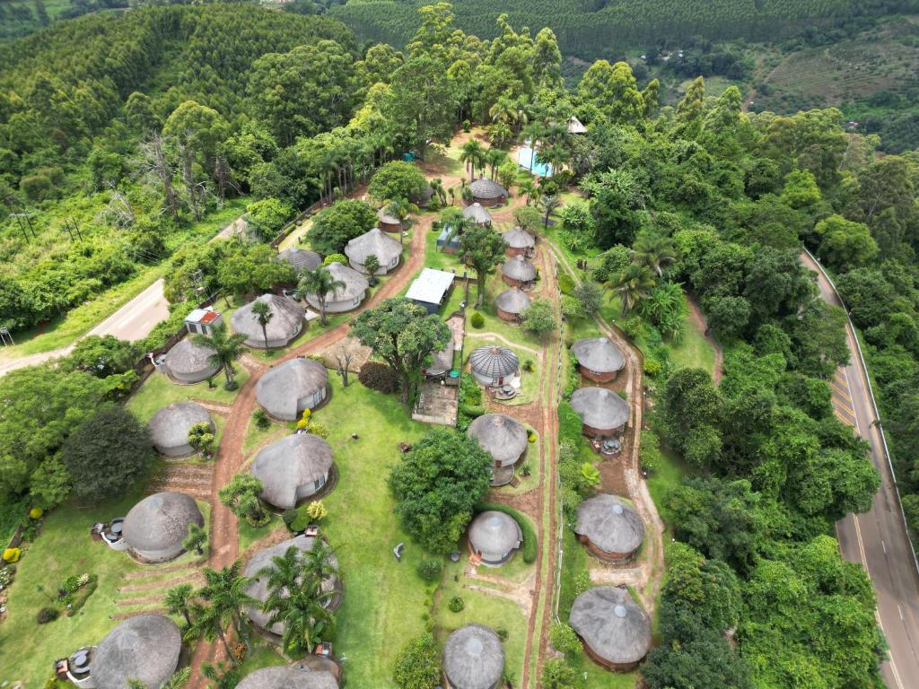 an aerial view of a garden with trees and rocks at Magoebaskloof Mountain Lodge in Tzaneen