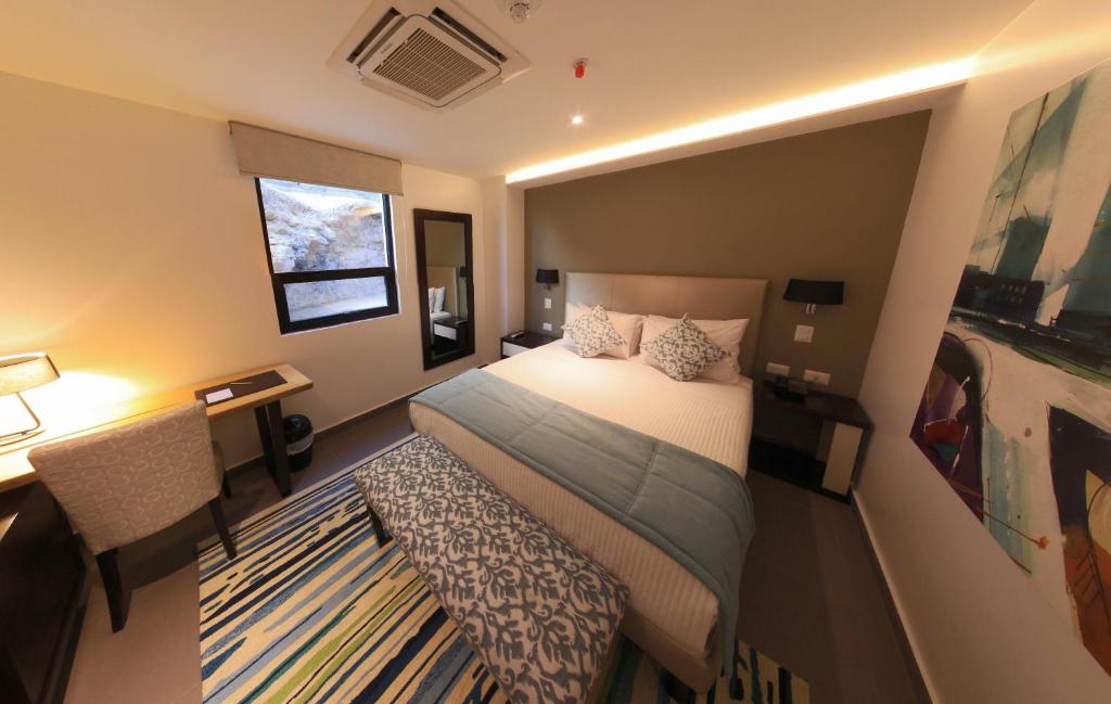 Postel nebo postele na pokoji v ubytování Hotel Poseidon