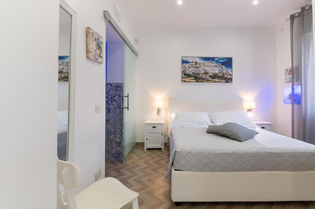 Postel nebo postele na pokoji v ubytování La Terrazza Sulla Rupe Relais