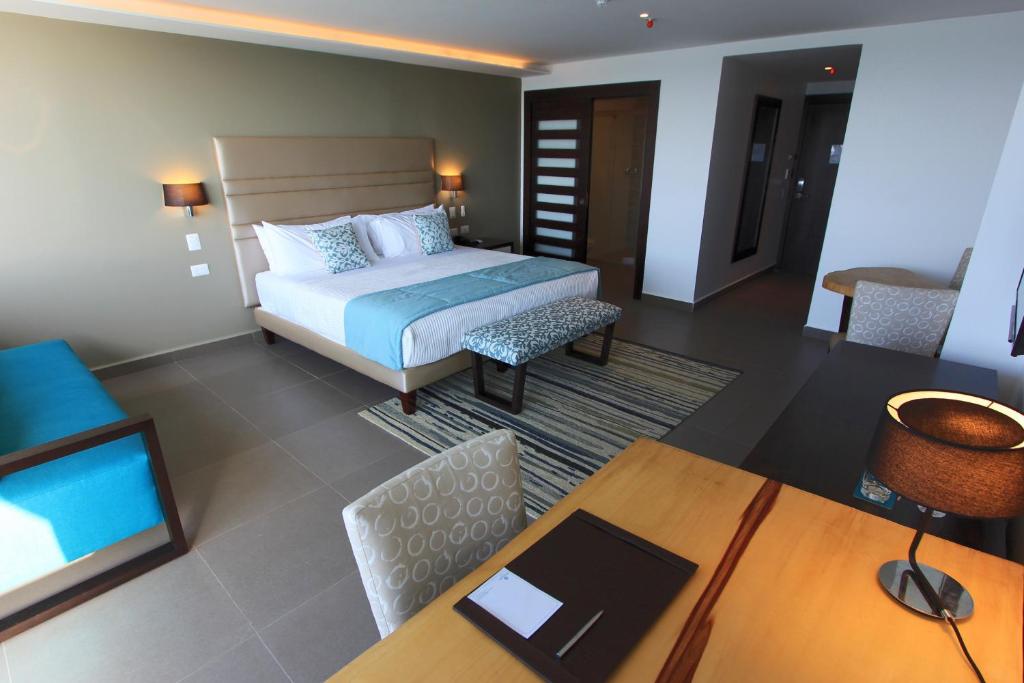 Postel nebo postele na pokoji v ubytování Hotel Poseidon