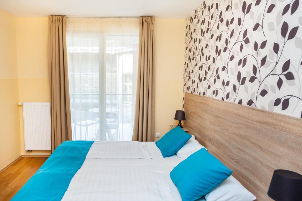 Posteľ alebo postele v izbe v ubytovaní Nova Apartments