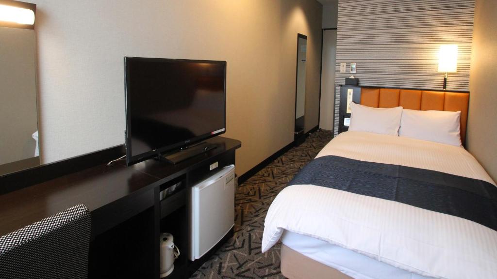 TV a/nebo společenská místnost v ubytování APA Hotel Fukuoka Yukuhashi Ekimae