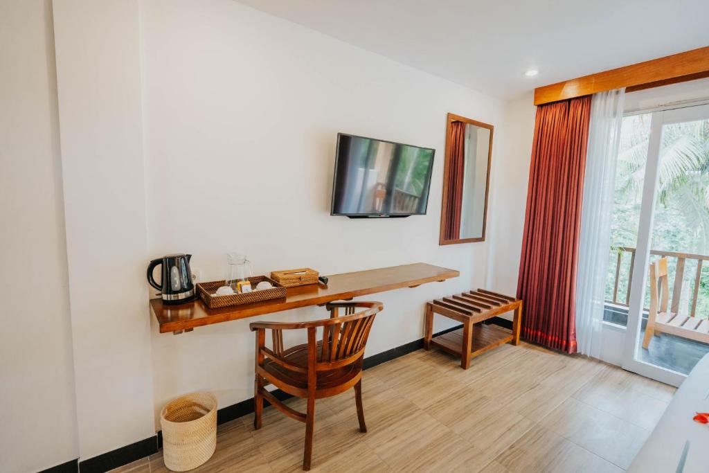 TV a/nebo společenská místnost v ubytování Alam Penari Resort Ubud