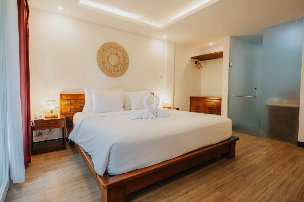 Postel nebo postele na pokoji v ubytování Alam Penari Resort Ubud