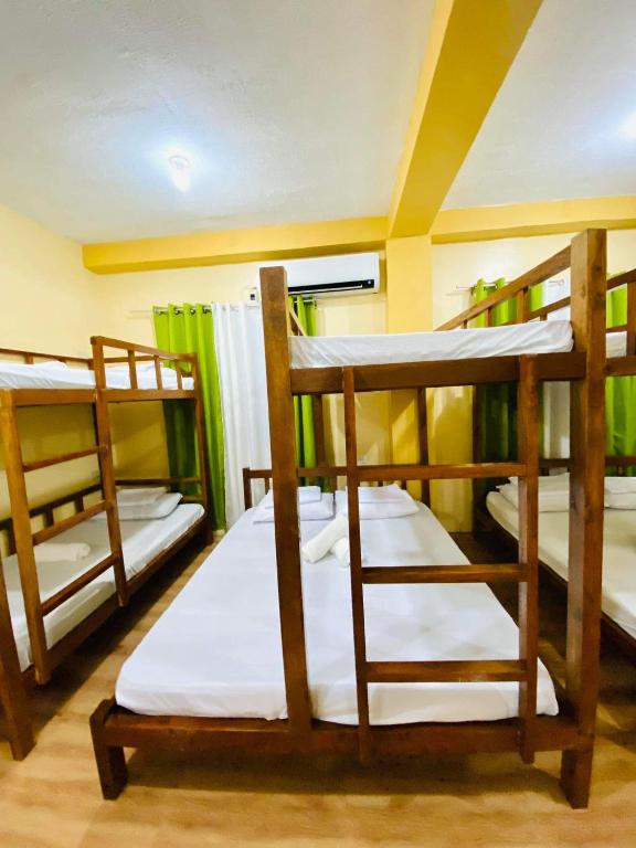 Postel nebo postele na pokoji v ubytování Hapitanan Siargao