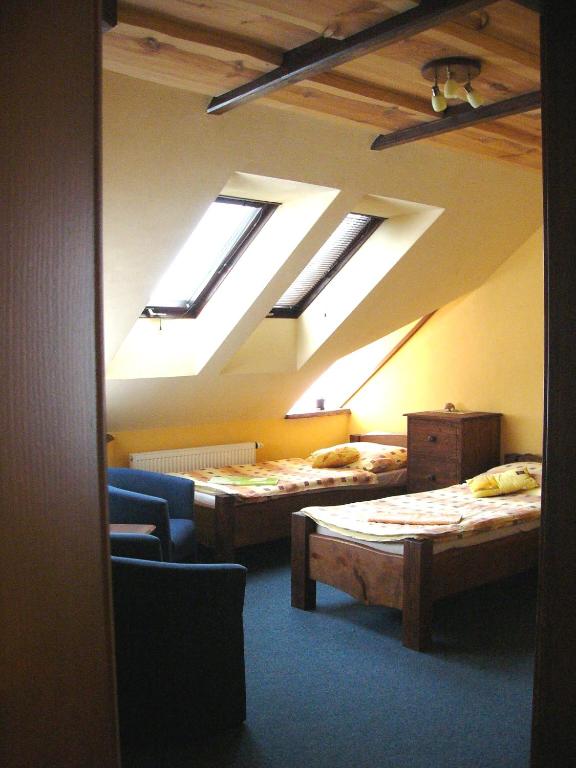 Postel nebo postele na pokoji v ubytování PENZION U TOČÍKA