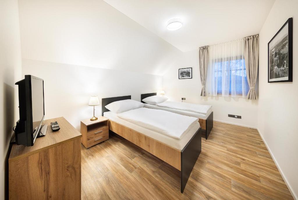 Postel nebo postele na pokoji v ubytování Pihel Apartments