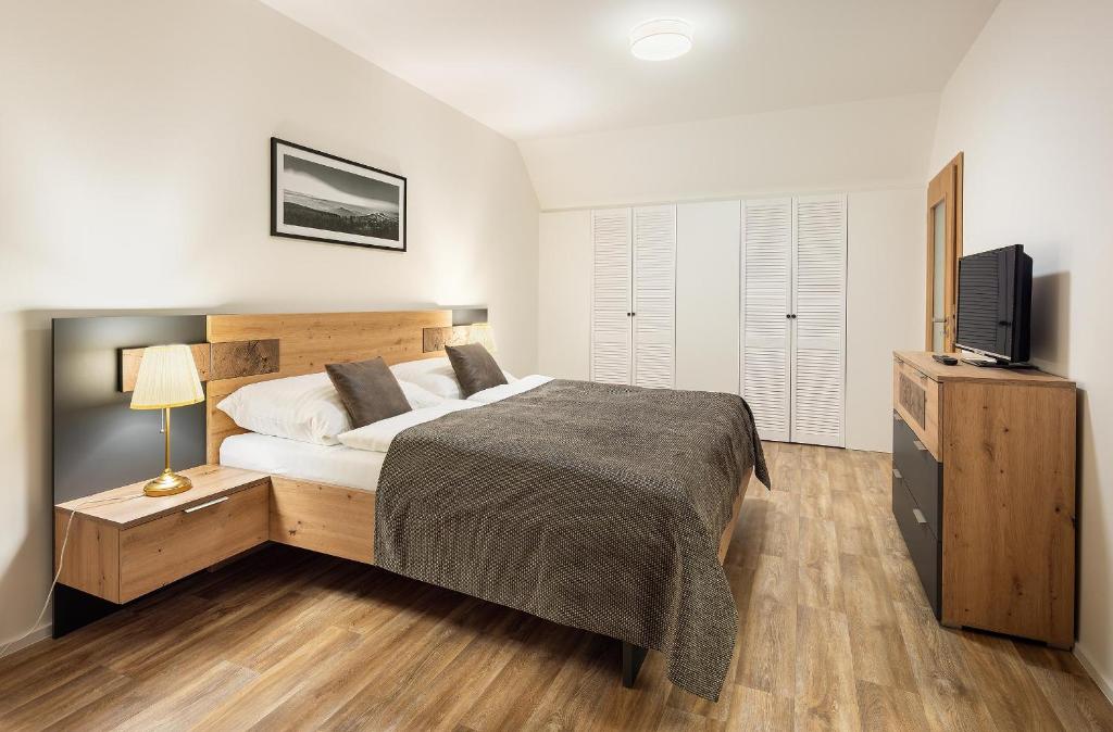 Postel nebo postele na pokoji v ubytování Pihel Apartments