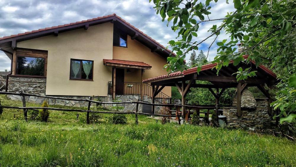 a house with a fence in front of it at Вила Приказка in Tsar Kaloyan