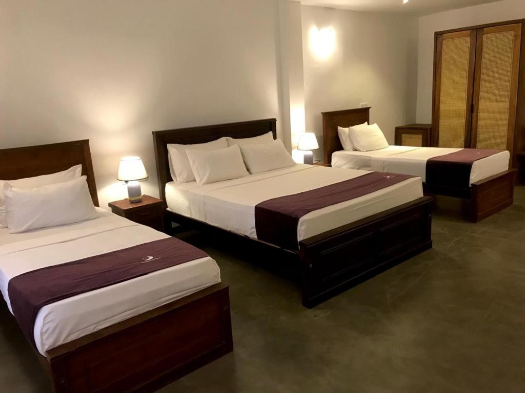 Postel nebo postele na pokoji v ubytování Tantalize Beach