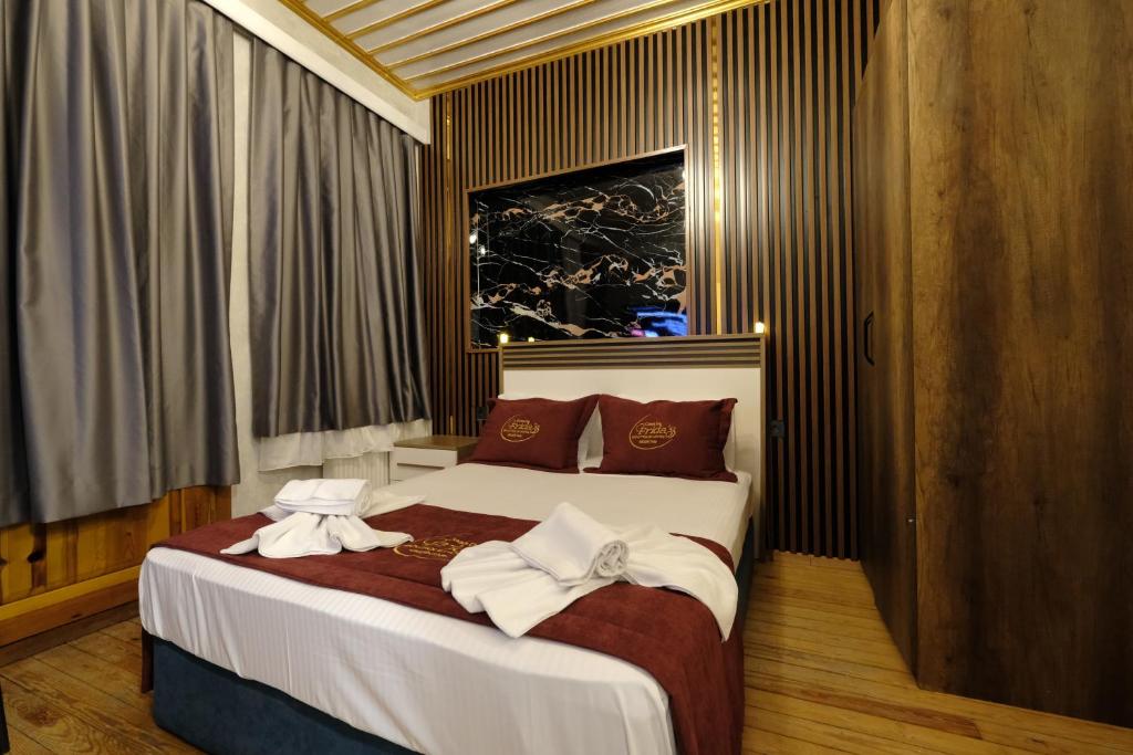 a hotel room with a bed with towels on it at CASA DE FRİDA'S BEŞİKTAŞ in Istanbul