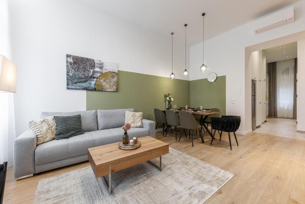 a living room with a couch and a table at Izabella66 apartment in Budapest