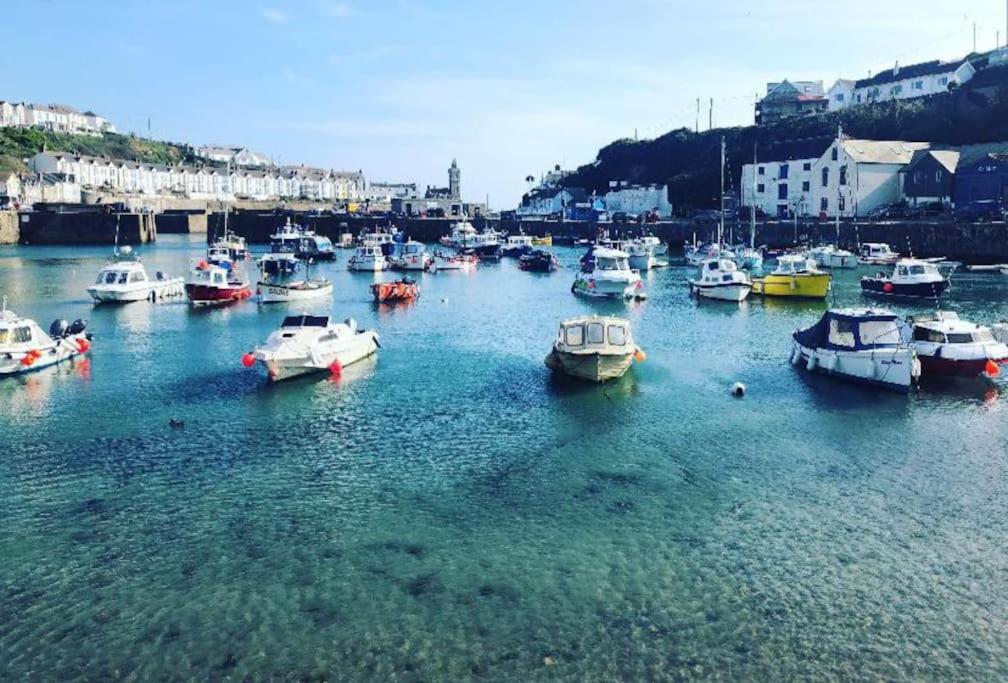 a bunch of boats are docked in a harbor at Guest Suite in Porthleven With Private Garden in Helston