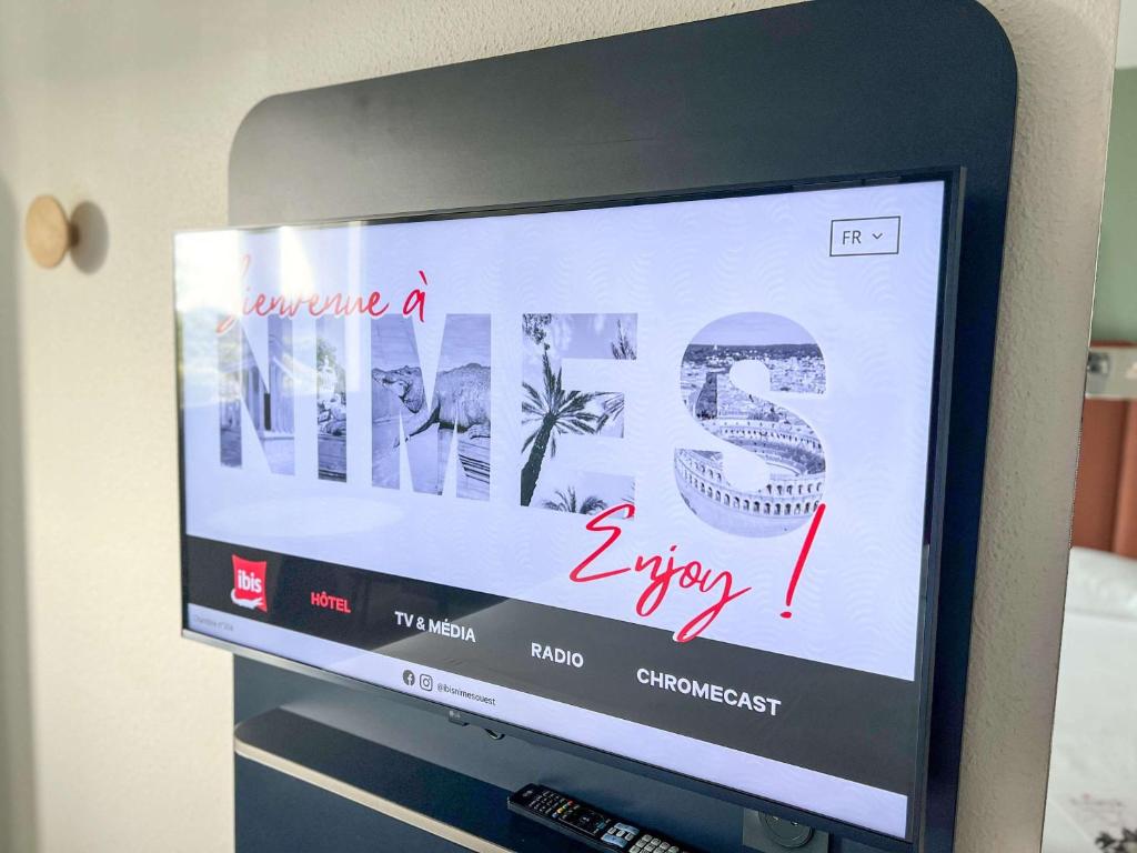TV a/nebo společenská místnost v ubytování ibis Nîmes Ouest - A9