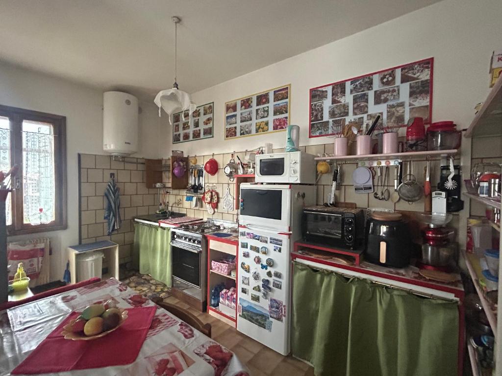 Kuchyň nebo kuchyňský kout v ubytování B&B Relax