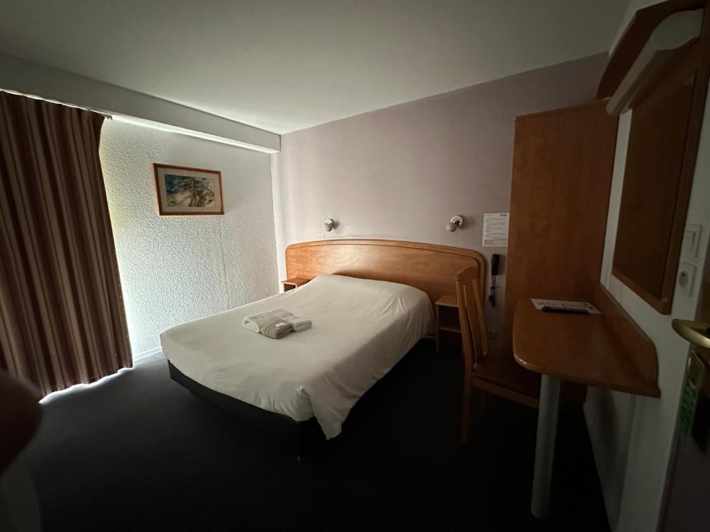 Postel nebo postele na pokoji v ubytování HAVANA Hôtel
