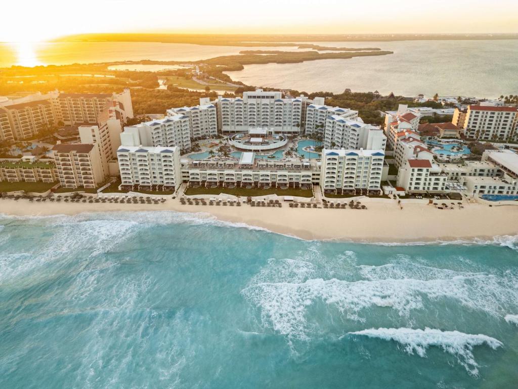 an aerial view of a resort on the beach at Hilton Cancun Mar Caribe All-Inclusive Resort in Cancún