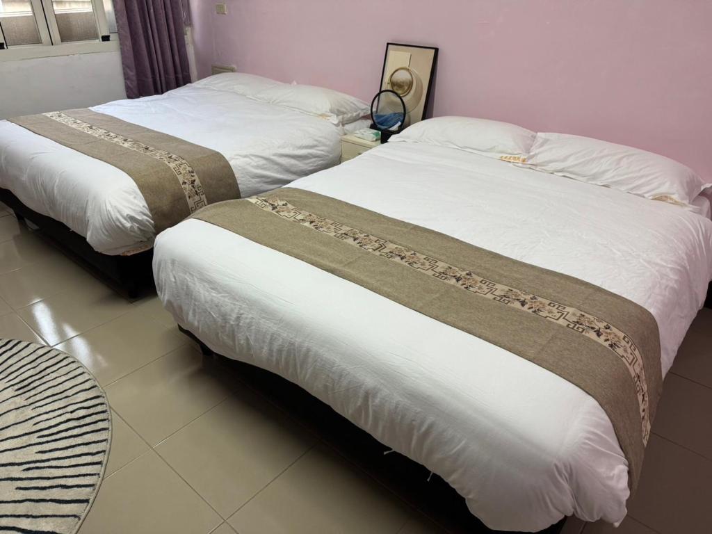 Postel nebo postele na pokoji v ubytování Lukang Hung-shiu Homestay