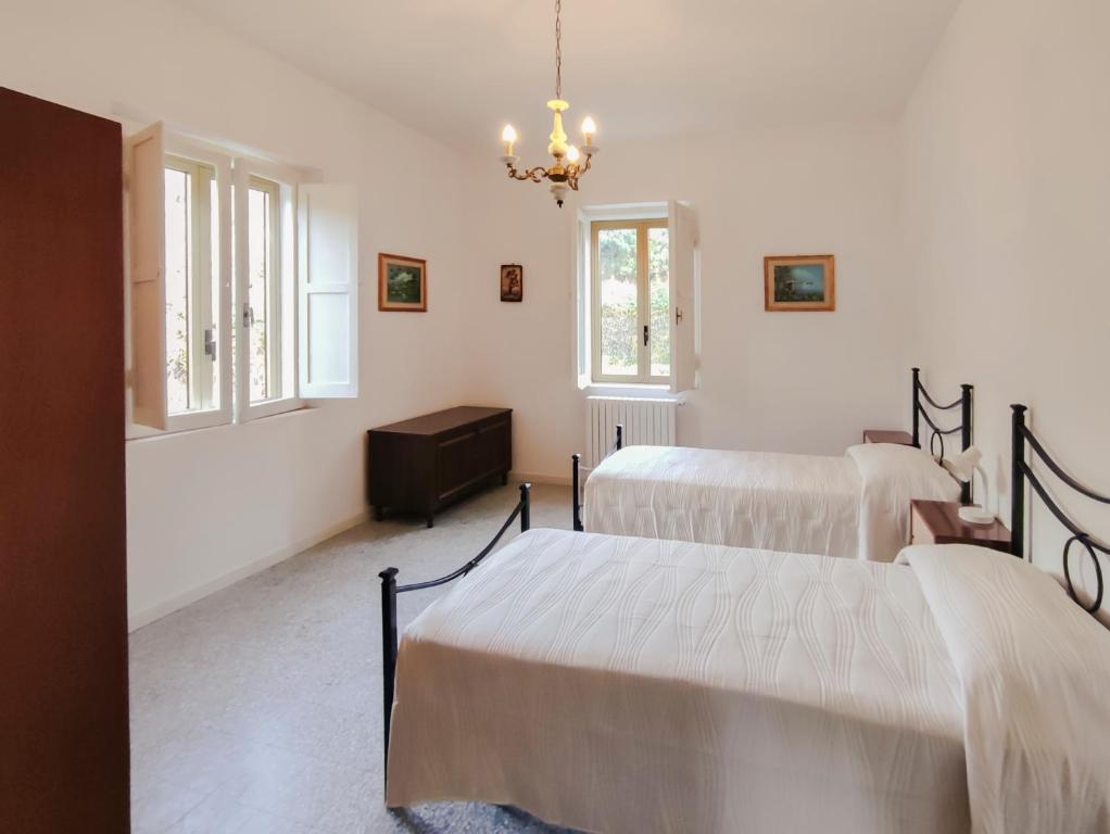 Postel nebo postele na pokoji v ubytování Casa con giardino tra mare e monti - Marche House