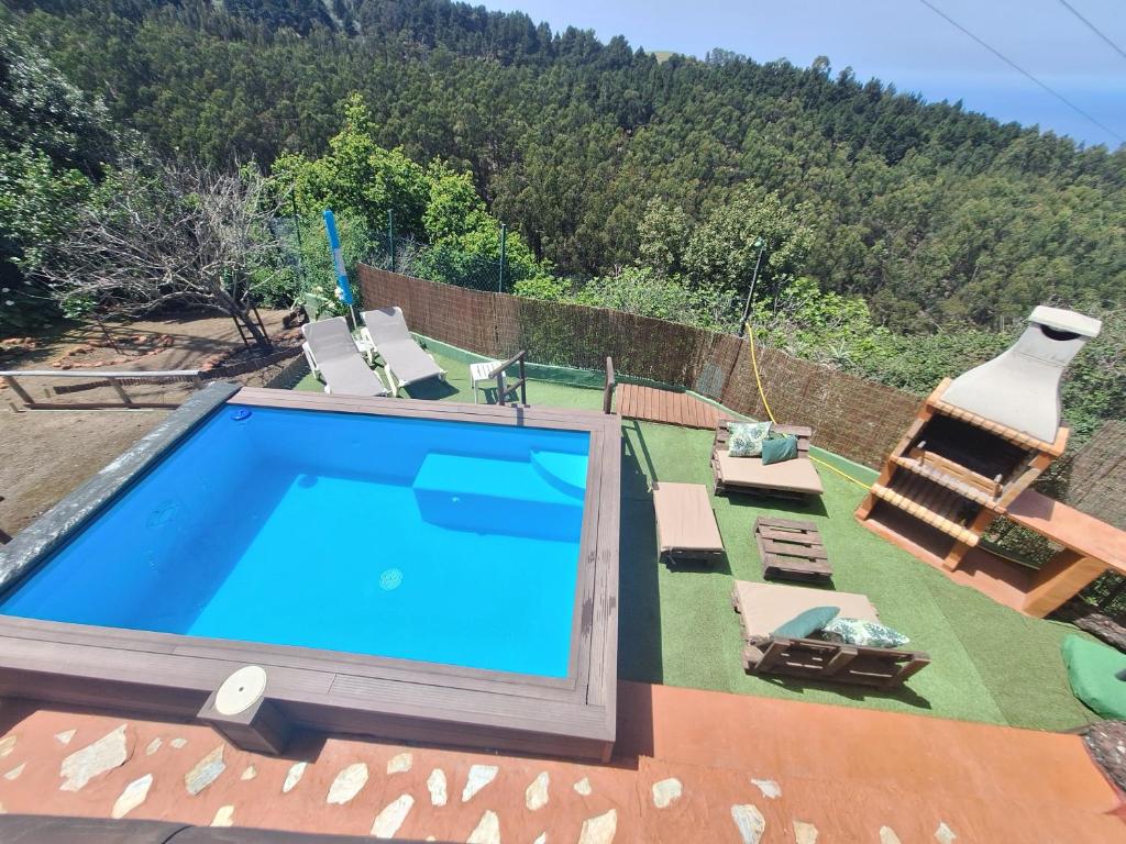 a large swimming pool on top of a house at Finca Esther in Las Palmas de Gran Canaria