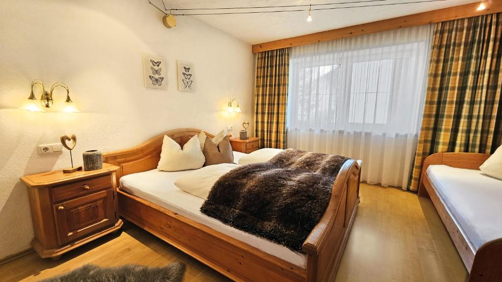 Postel nebo postele na pokoji v ubytování Ferienanlage Hechenbergerhof