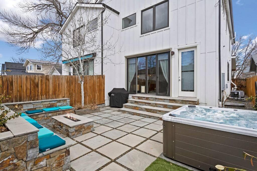 a backyard with a hot tub in the yard at Luxury Home: Monthly Rental House Near Denver in Englewood