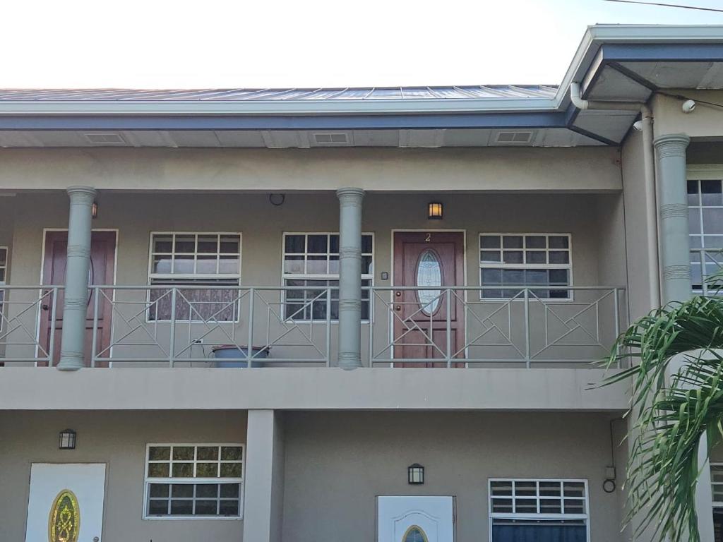 a building with a balcony with a person on it at Cozy one bedroom apartment in Lambeau