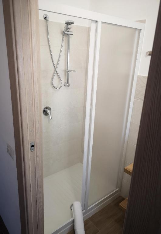 a shower in a bathroom with a glass door at Villa Azzurra in Lampedusa