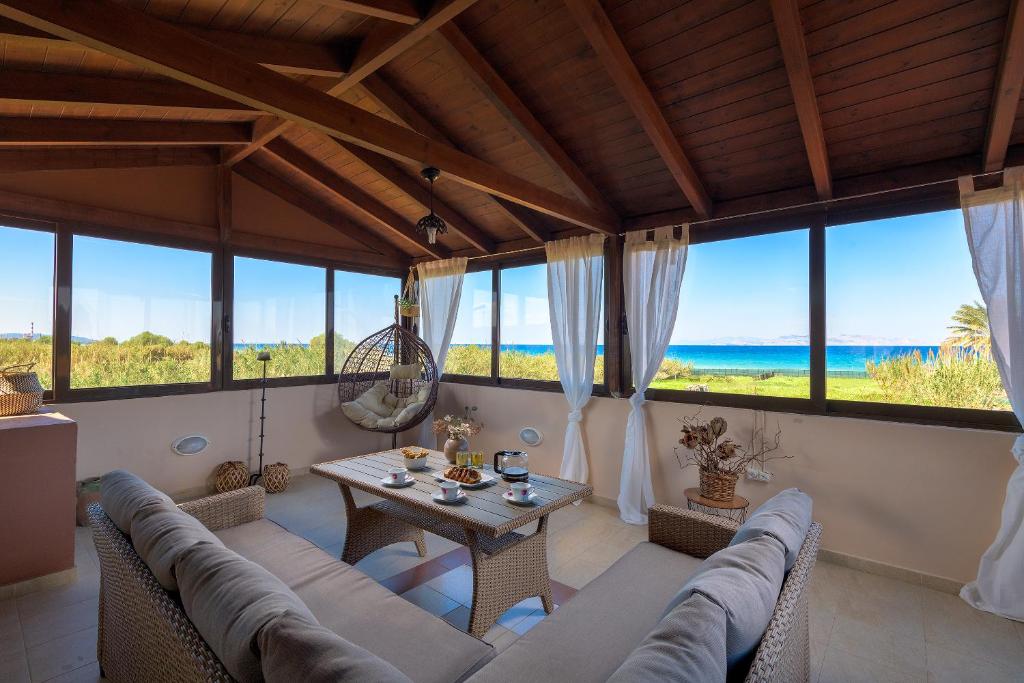 a living room with a couch and a table at Villa Vera in Paradeísion