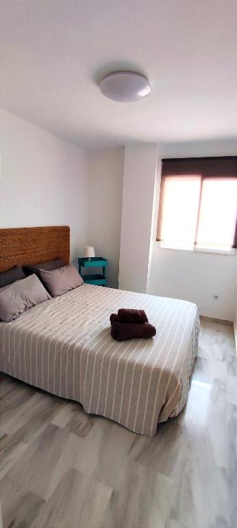 Posteľ alebo postele v izbe v ubytovaní Apartamento Plaza Toros