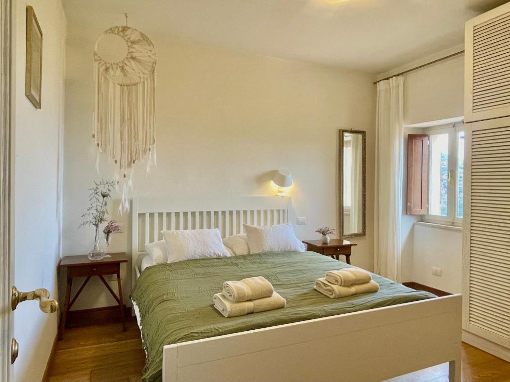 A bed or beds in a room at Aria di Collina - Isola d'Elba