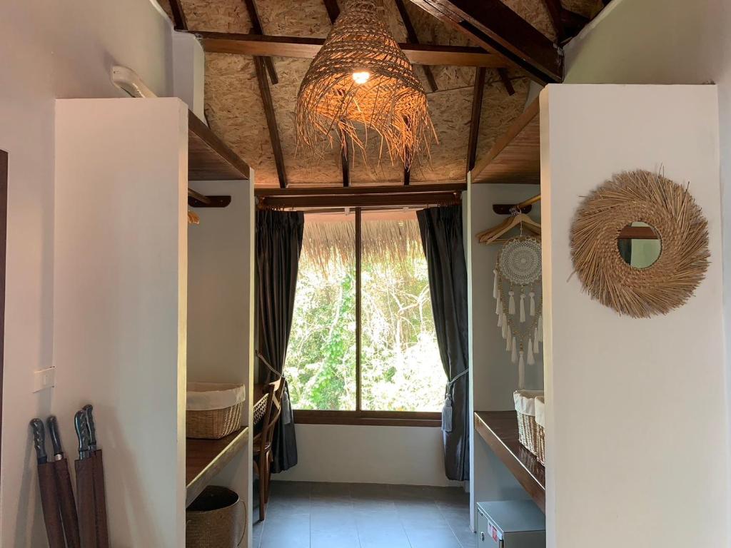 Postel nebo postele na pokoji v ubytování Kohtao Heritage Hideaway